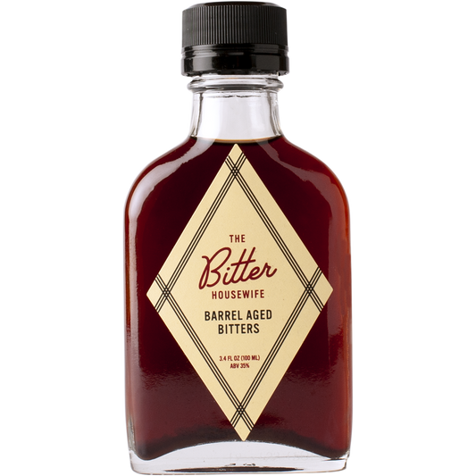 The front of a bottle of The Bitter Housewife Barrel Aged Cocktail Bitters