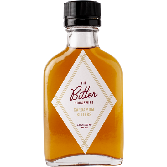 The front of a bottle of The Bitter Housewife Cardamom Cocktail Bitters